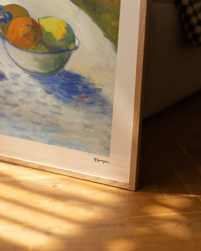 Flowers and a Bowl of Fruit on a Table